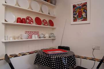 The dining-area in the kitchen. From here three steps lead to the sitting-room.
