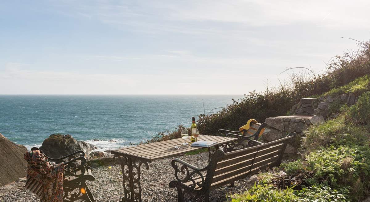 The steep terraced garden has spectacular views across the village and cove and is accessed via steep stone steps to the rear of the cottage.