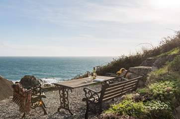 The steep terraced garden has spectacular views across the village and the cove and is accessed via steep stone steps to the rear of the cottage.