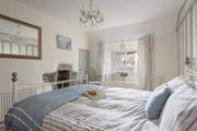 The main bedroom (Bedroom 1) is very calming and has a small en suite shower-room.