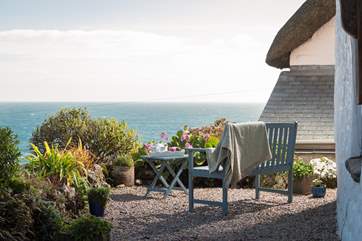 Soak up the morning rays at the front of the cottage, watching the world pass you by.