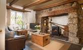 Room to relax with friends and family in the cottage sitting-room, with a cosy wood-burner effect electric stove. - Thumbnail Image