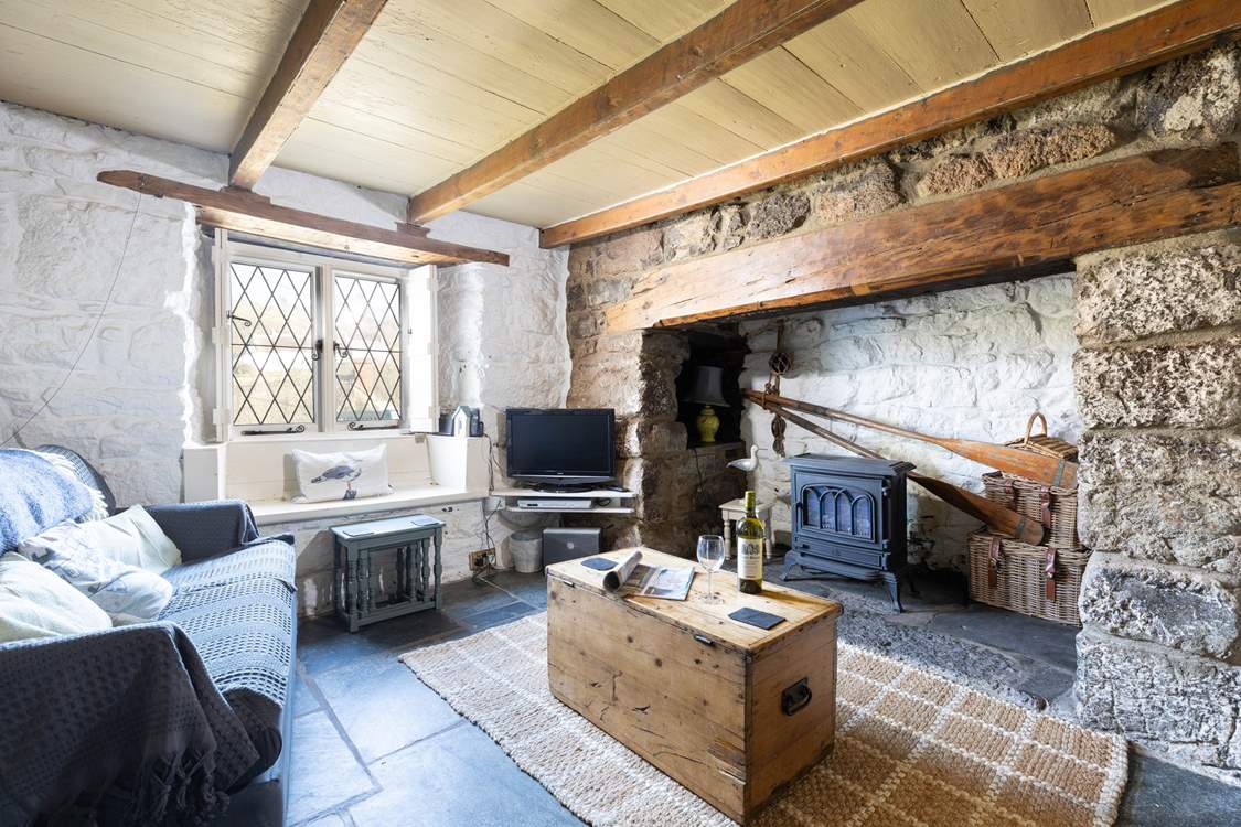 The sitting-room is opposite the dining-room, both of which are either side of the entrance hallway.