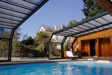 The pool house with the roof open.