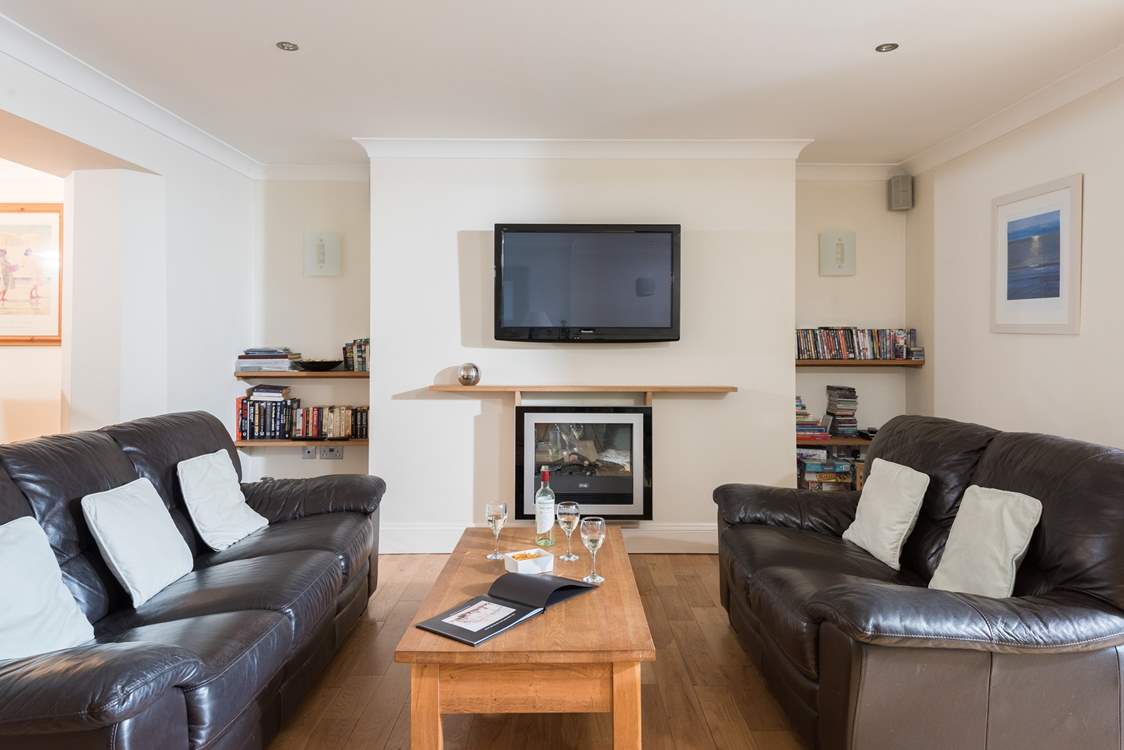 Comfortable sofas, a warming fire and a large TV to relax in front of with a good film.