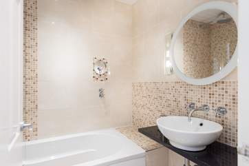 The bathroom en suite to Bedroom 1.