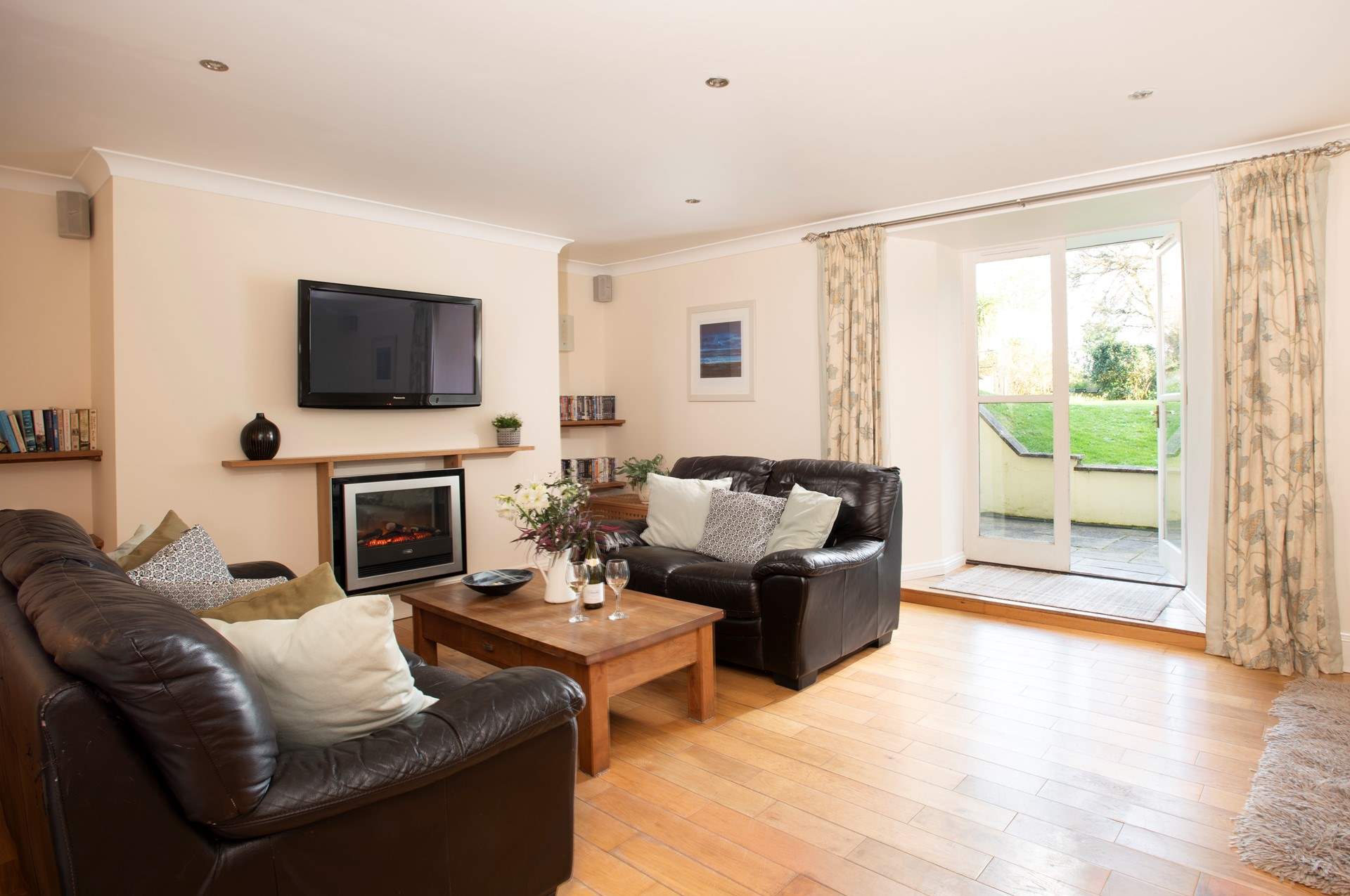 Doors lead out to the private terrace and shared garden.