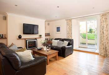 Doors lead out to the private terrace and shared garden.