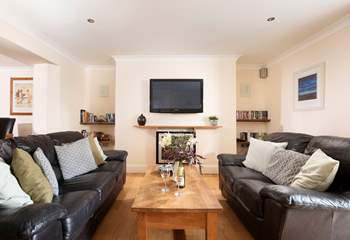 Comfortable sofas, a warming fire and a large TV to relax in front of with a good film.