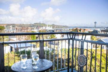 Enjoy a glass of wine on your small balcony looking over Falmouth and to the sea beyond.