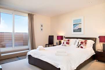Two steps take you from the master bedroom, out to the balcony.