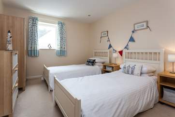 The pretty twin bedroom is located on the first floor.