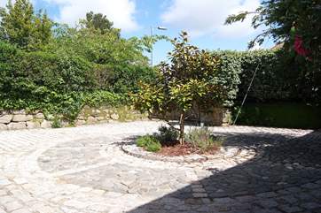 The rear enclosed parking-area.