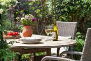 The sunny rear garden has many hidden little spots, which are perfect for a glass of wine.
