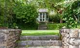 The beautiful garden is full of green leaves and both sunny and shady spots for holiday relaxing. - Thumbnail Image