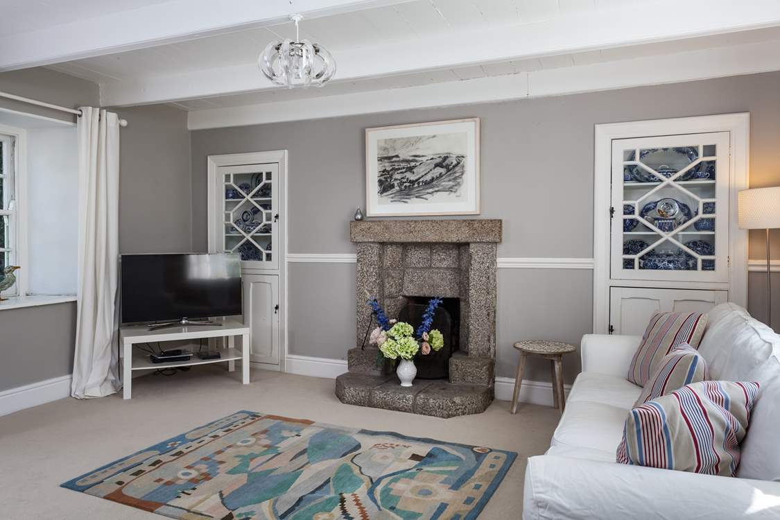 The second sitting-room, with a TV and open fire.