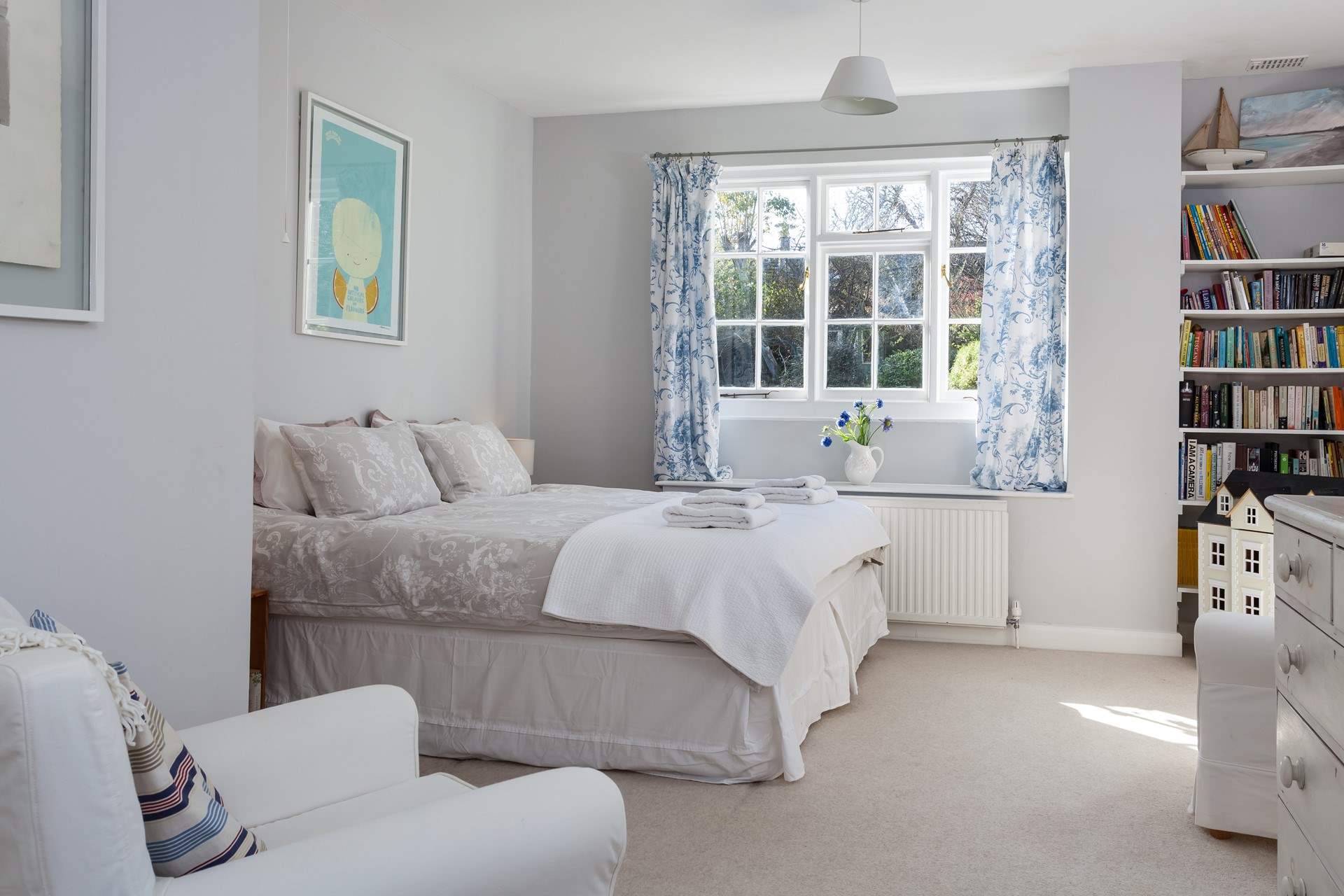 Bedroom 4 has a king-size bed and wash-basin.