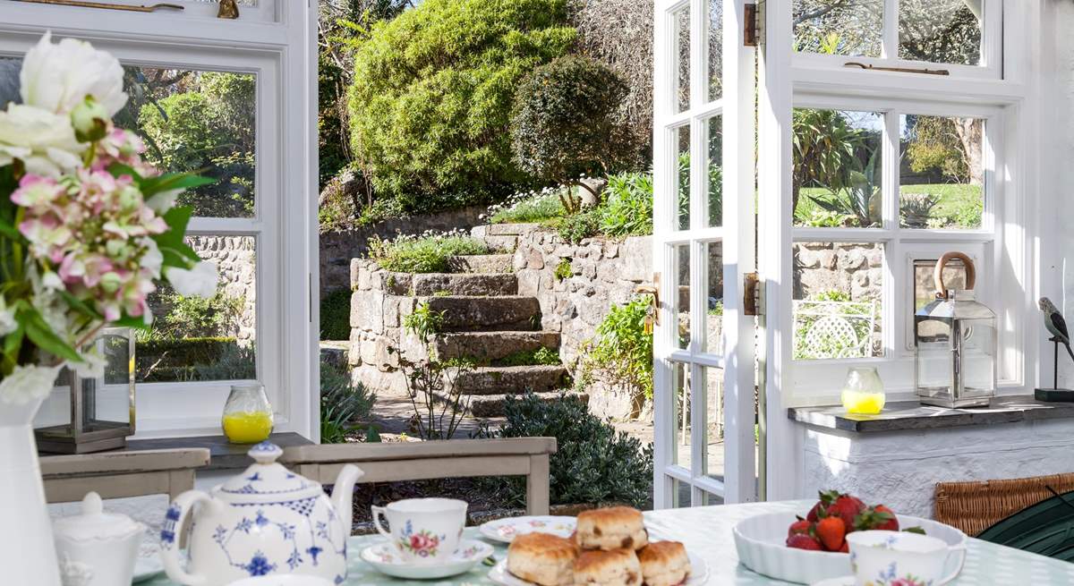 The sunny garden-room has patio doors which lead out onto the rear garden.