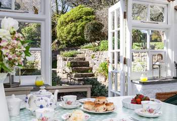 The sunny garden-room has patio doors which lead out onto the rear garden.