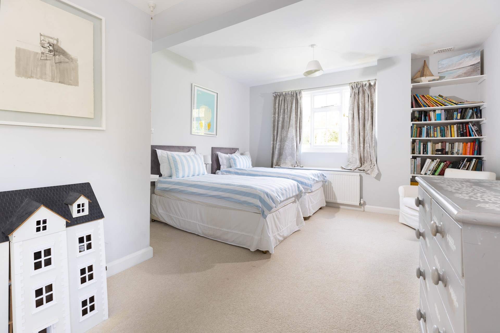 Bedroom 3 is spacious and bright and full of lovely soft furnishings.