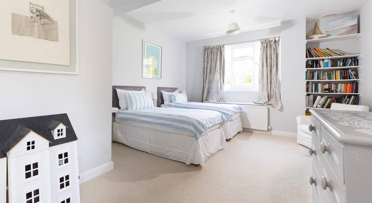 Bedroom 4 is spacious and bright and full of lovely soft furnishings.