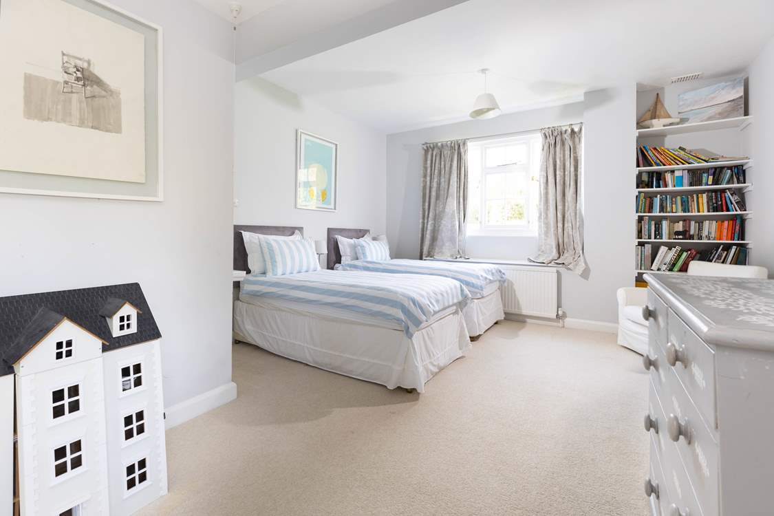 Bedroom 3 is spacious and bright and full of lovely soft furnishings.