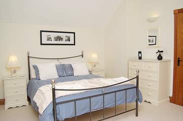 The exceptionally spacious master bedroom with king-sized bed.