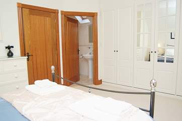 The master bedroom has its own en suite shower-room and plenty of built-in storage space.