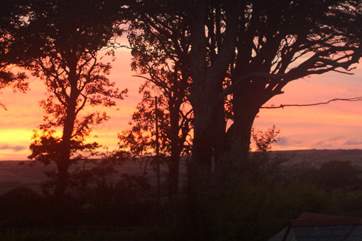 Sunset over the garden and fields.