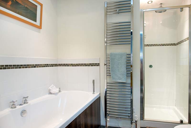 Bedroom 1 has a stylish en suite bathroom which also has a separate shower.