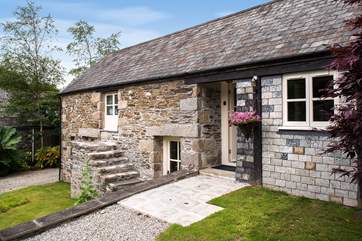 The front of the cottage which has a front door on the lower as well as the upper level - with the annexe on the right.