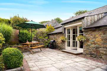 At the rear of the cottage there is a sunny patio-area and huge shared garden to play in - you won't want to leave.