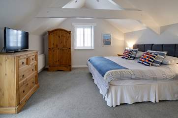 Delightful bedroom 2 has a 'zip and link' bed so it can be made up as a 6' super-king or ……...