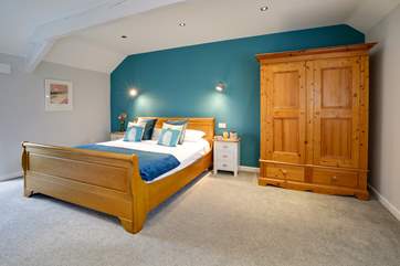 Bedroom 1 is wonderfully spacious with a super-king size sleigh bed.