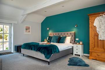 Bedroom 1 is wonderfully spacious with a super-king size sleigh bed