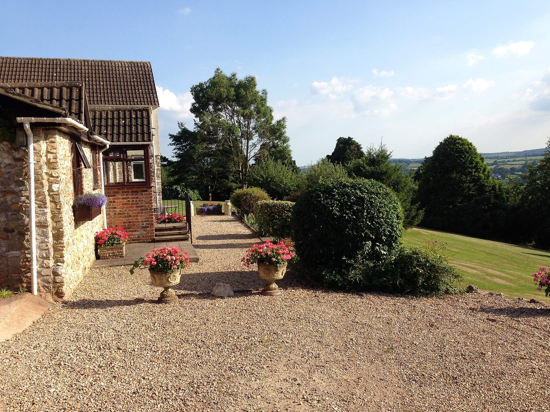 The lovely front garden for you to enjoy to the right of the photo. Parking is on the gravelled area.