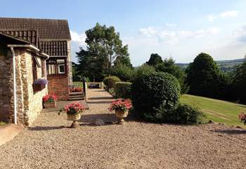 The lovely front garden for you to enjoy to the right of the photo. Parking is on the gravelled area.