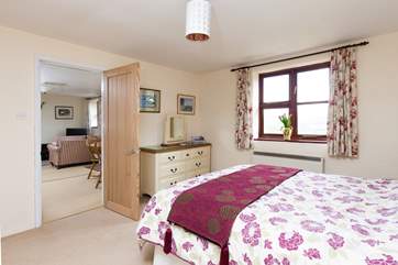 This bedroom is at one end of the cottage and the other bedroom is at the opposite end - so you will have plenty of privacy.