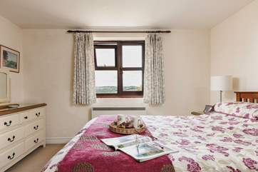 The master bedroom looks out over the countryside right across the valley.