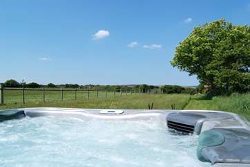 The hot tub has views out across the grounds.