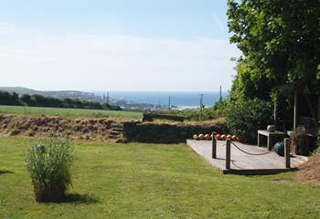 The deck area has superb views over fields to the sea beyond.