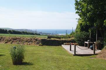 The deck area has superb views over fields to the sea beyond.