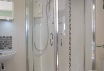 The shower-room has a quadrant shower cubicle and heated towel rail to warm the towels.