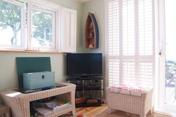 The TV is located in the corner of the sitting-room and you are able to enjoy Netflix.