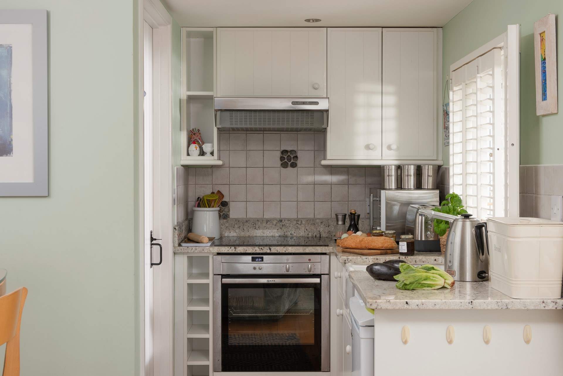 The well equipped kitchen has everything you might need. The shower room is through the door on the left. 
