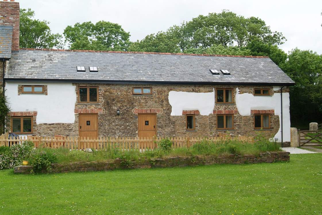 The gravelled patio is enclosed but there is plenty of room to play a game. This beautiful cottage is both spacious and homely.