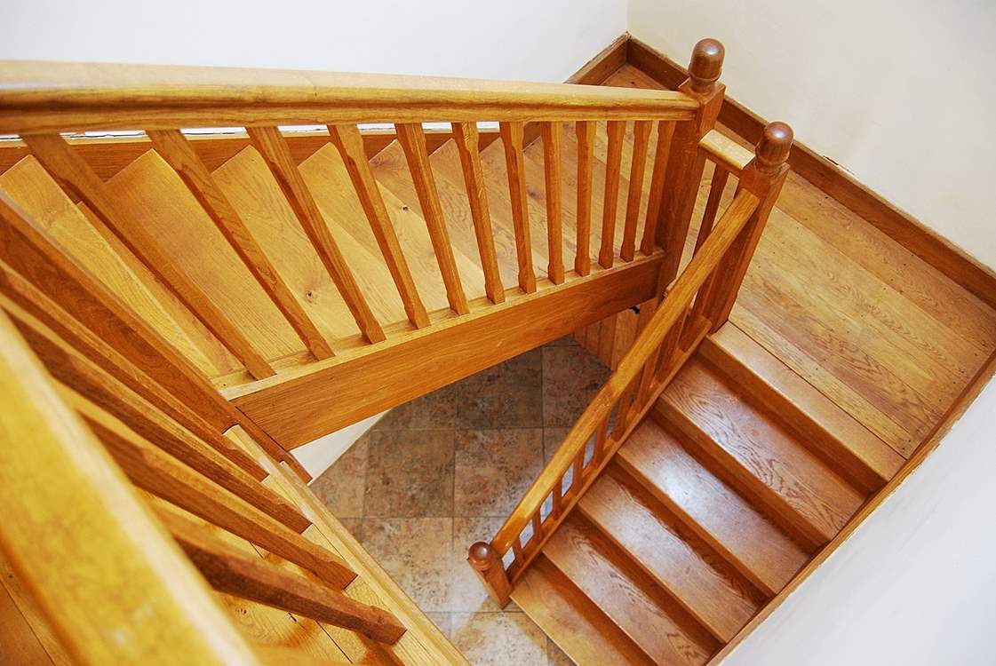 The solid oak staircase leading up to bedroom 2 and the sitting-room.