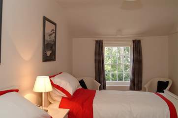 The twin bedroom looks out over the garden.