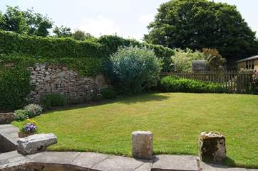 The garden with patio and lawn areas.