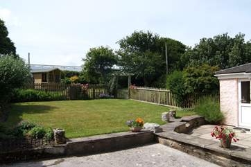 The sunny enclosed private garden is ideal for relaxing outside.